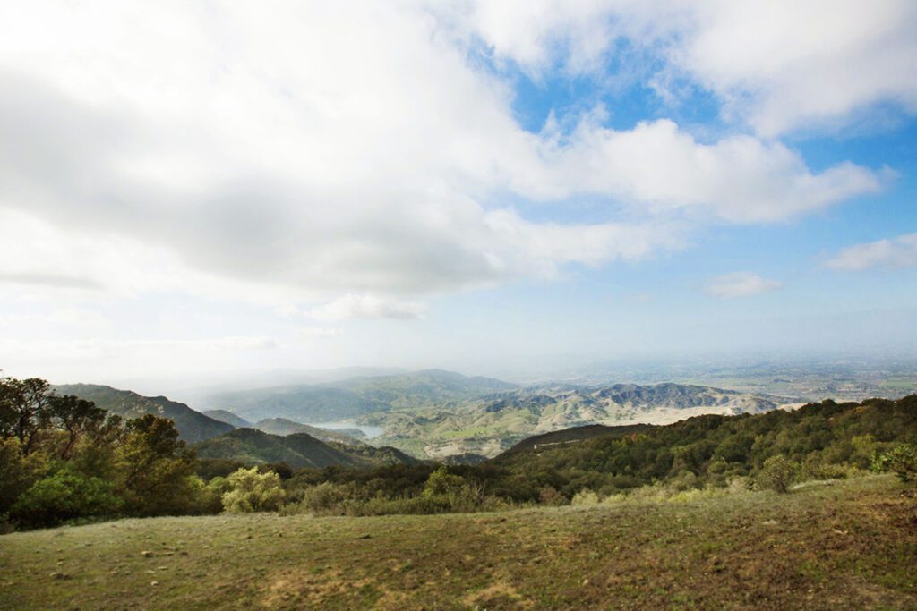 From the Dos Vistas two views atop a mountain surrounded by trees you see on one side the glistening Pacific Ocean while on the other the beautiful Santa Ynez Valley.