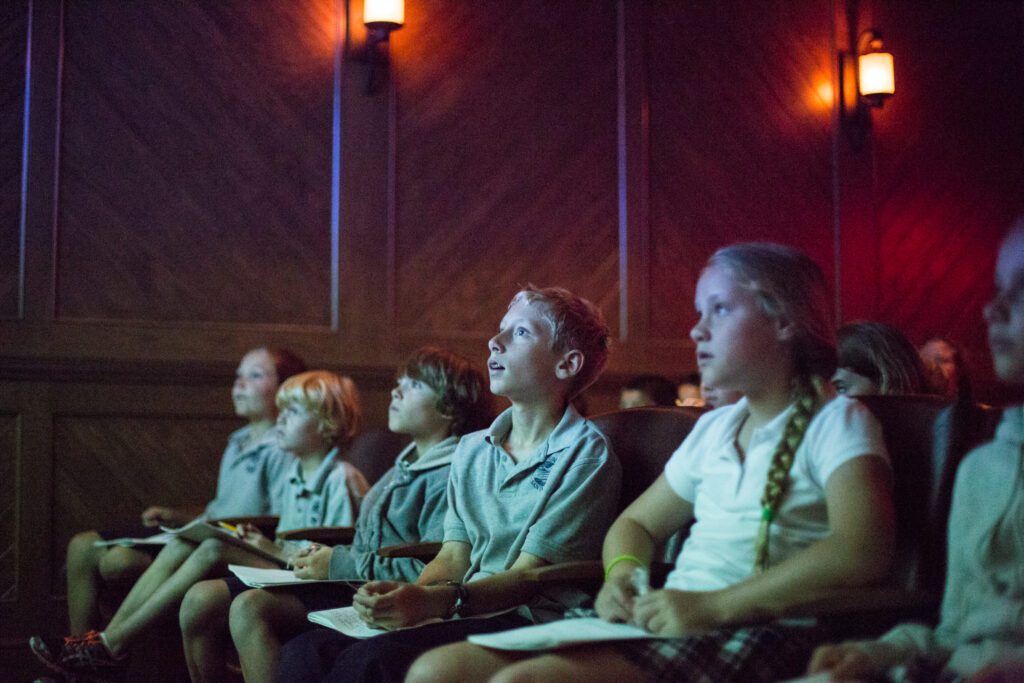 Students learn about President Reagan and the ideas he championed in the movie theater at the Reagan Ranch Center